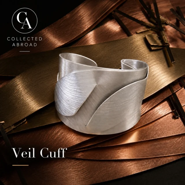 The Veil Cuff has arrived.

Sculptural folds of hand-formed metal create movement, shadow, and light—designed to feel more like wearable art than jewelry.

Now part of the Nocturne Collection.

#CollectedAbroad #NocturneCollection #StatementJewelry #WearableArt #ArtisanMade